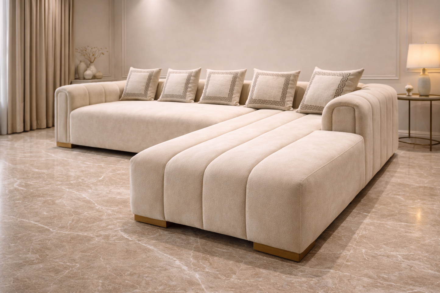Beige sectional sofa in a modern living room setting with neutral decor.